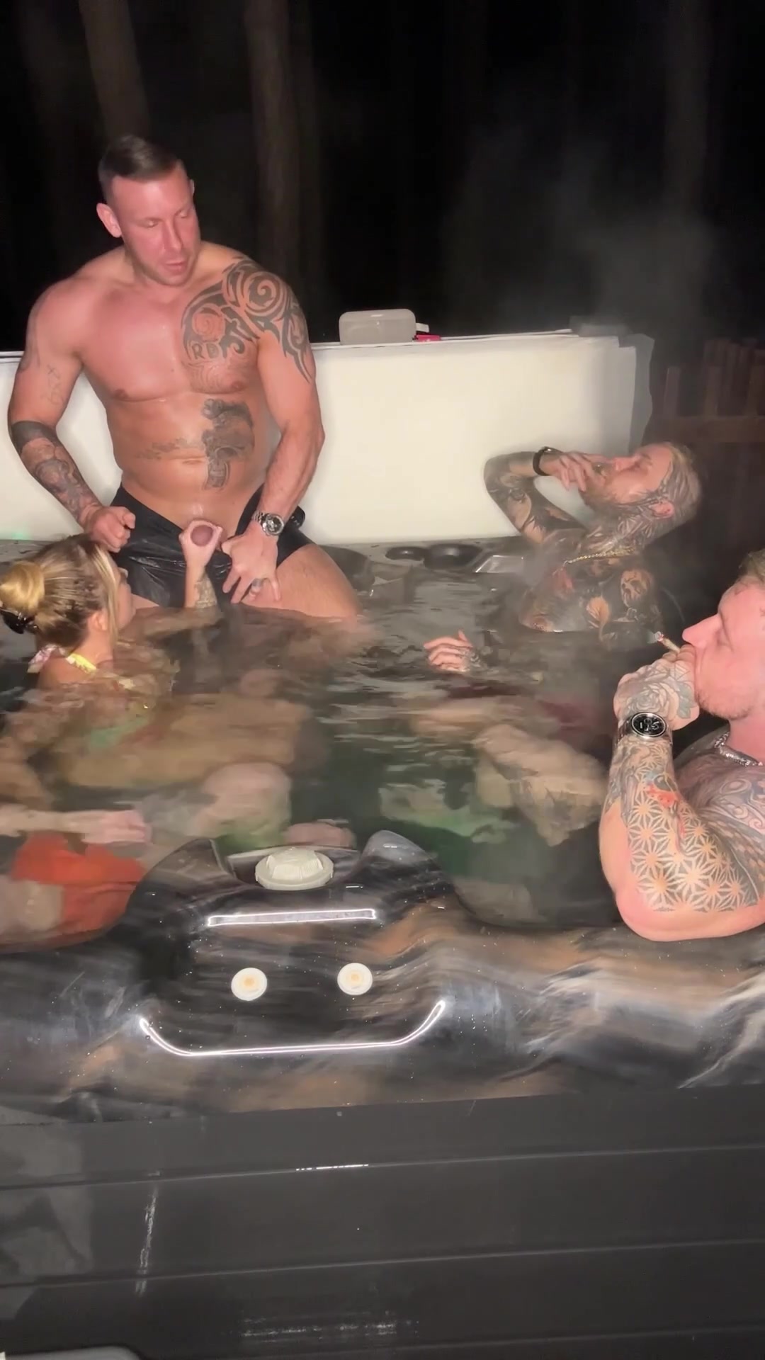 Giving him a handjob in the hot tub in front of his friends - free porn video