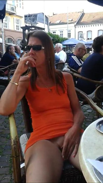 Milf Rubbing her Clit in a Public Cafe - free porn video