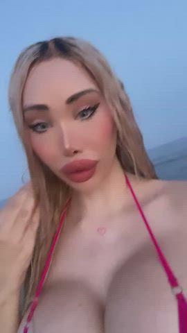Plastic doll at the beach - free porn video