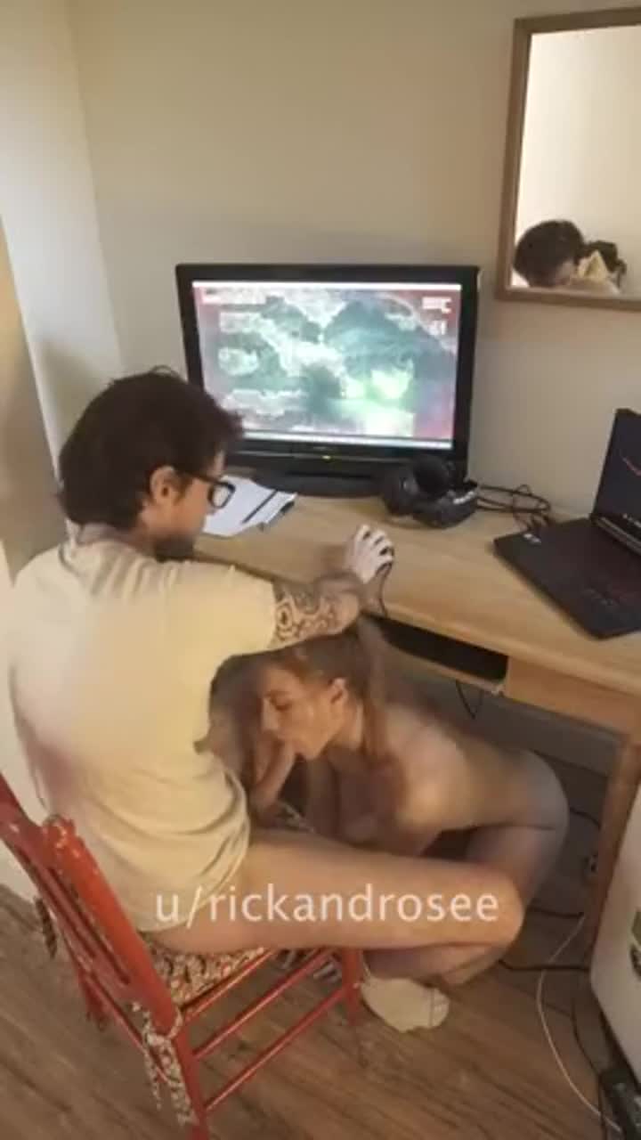 Having fun throating his dick and making it twitch while he's using his pro gamer set-up - free porn video