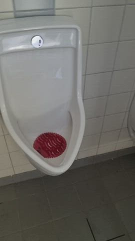 Fucking girlfriend's throat at the urinals - free porn video