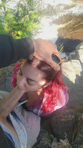 While next to the wild rapids of this waterfall, he fucks her face - free porn video