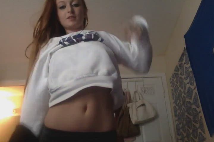 Hot redhead taking off her clothes - free porn video