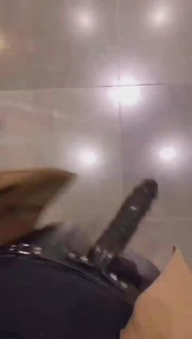 Straponed in a public toilet - free porn video
