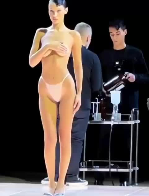 Bella Hadid Gets Dress Spray Painted on Half Nude Body at Runway - free porn video